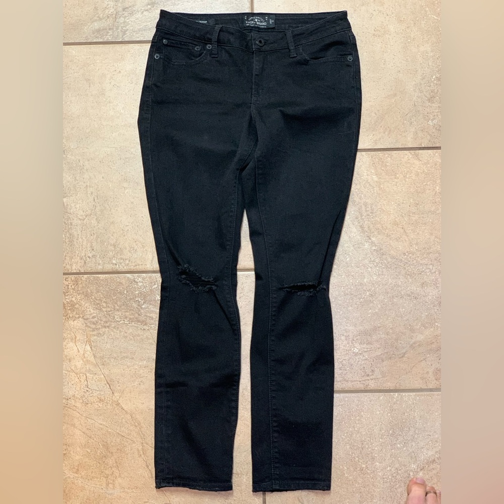 Lucky Brand new without tags size 4 with torn knees